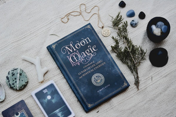 Moon Magic book, herbs, crystals, cards Photo by Content Pixie on Unsplash